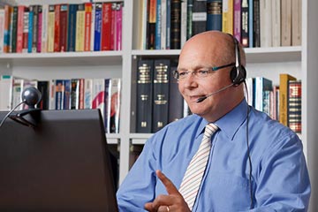 Man conducting a video conference on laptop