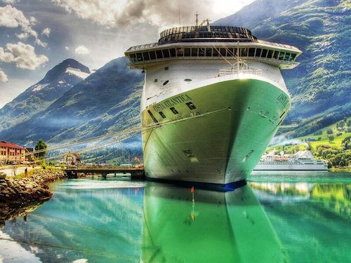 A cruise ship docked in a small village